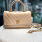 CHANEL Beige Coco handle flap bag